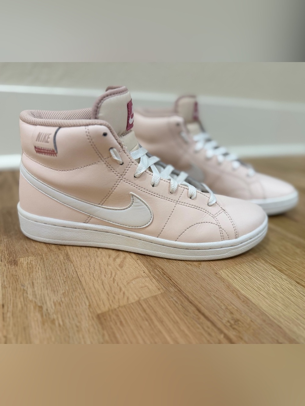 Nike Women's Blush Pink High-Top Sneakers with White Swoosh
